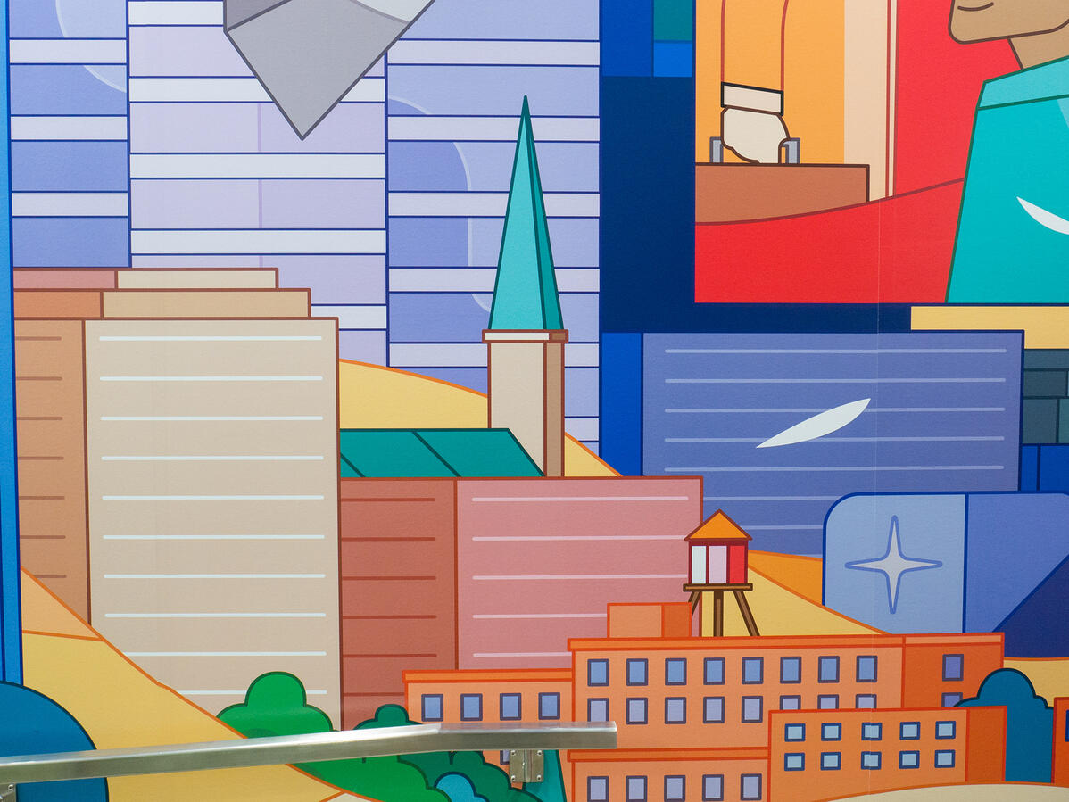 Une murale imprimée de l'artiste Lucas Saenger, représentant des bâtiments de Montréal ainsi que sa canopée.